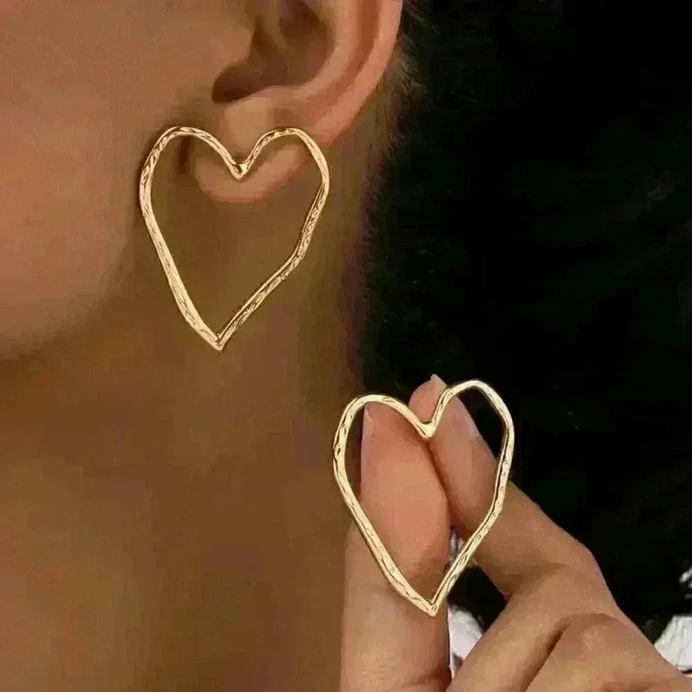 Hollow Heart Shaped Stud Earrings - Picture 2 of 5